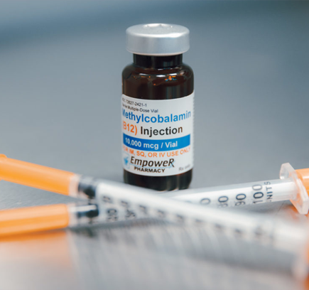 A vial of Methylcobalamin (B12) injection with two syringes.